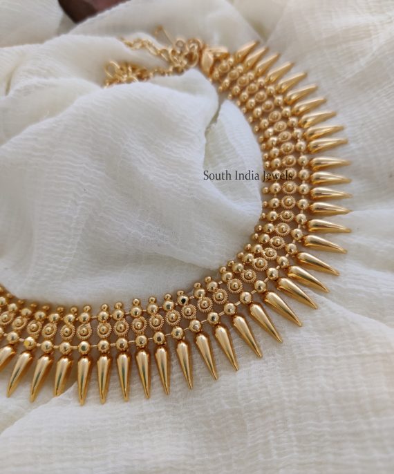 Mullamottu necklace looks very simple and elegant. Necklace - Length 40.64 cms, gold polish.