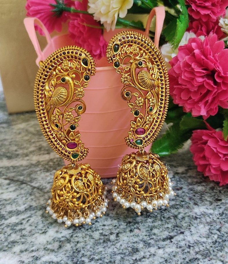 Pretty peacock design gold finish jhumkas.