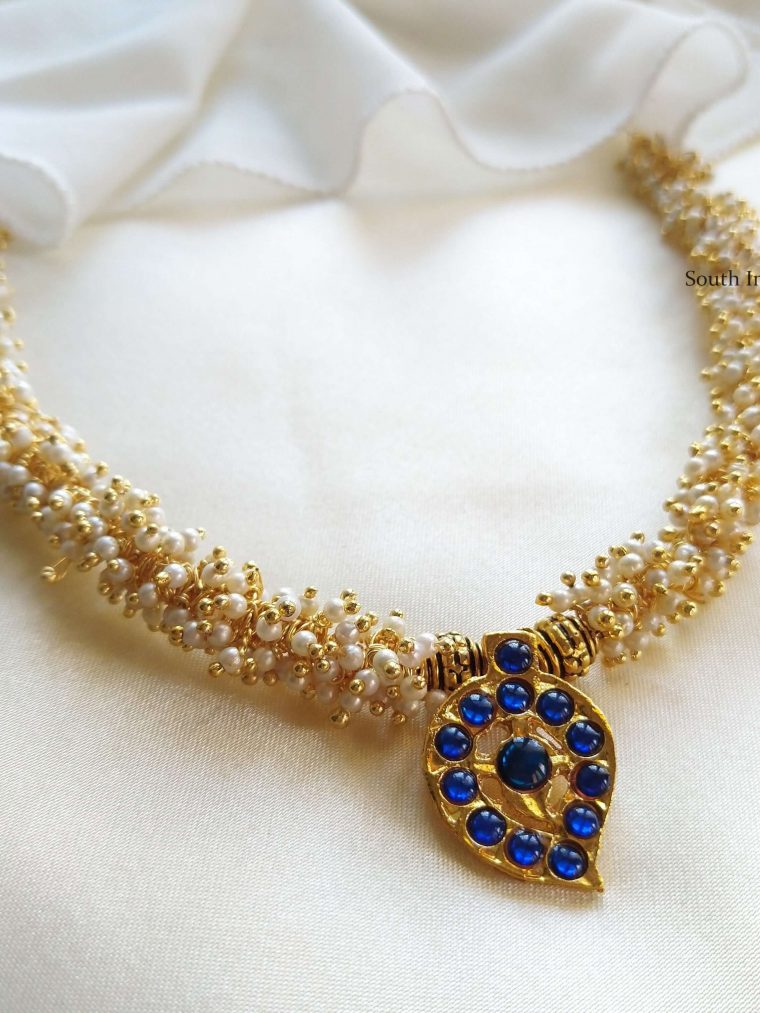 This will be your new favorite to style with sarees. Also shop more Kemp Mango Pendent Necklace at South India Jewels.