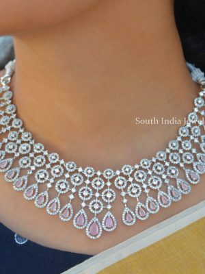 Cute Pale Pink Rodium Polish Bridal Necklace. This is a beautiful necklace suitable for all kinds of attires. Shop more Cute Pale Pink Rodium Polish Bridal Necklace at South India Jewels.