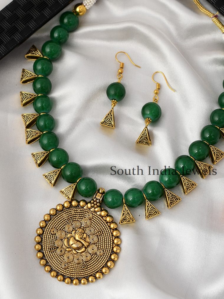 Antique Ganpati designed Pendant in Antique Gold Plated Green Necklace set