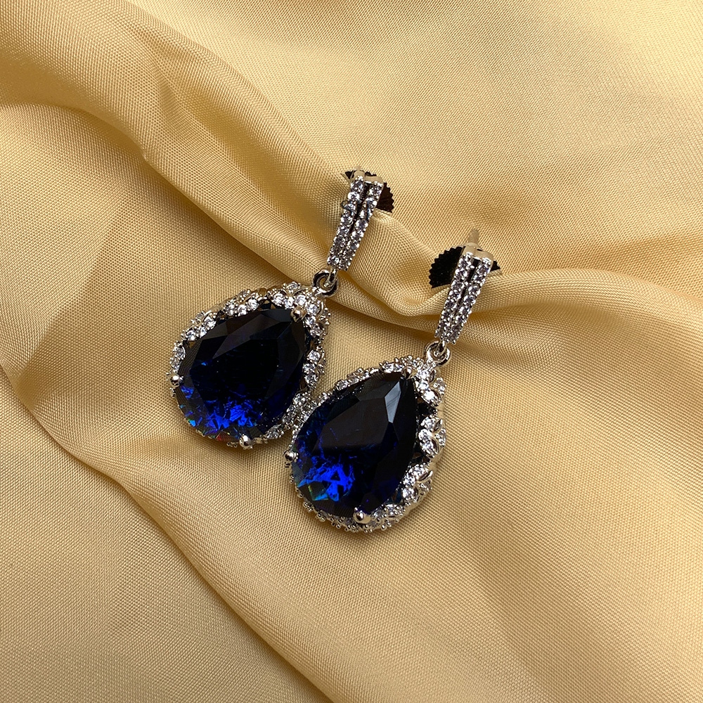 Trendy AD Stones Ear Studs with Blue Tear Drop