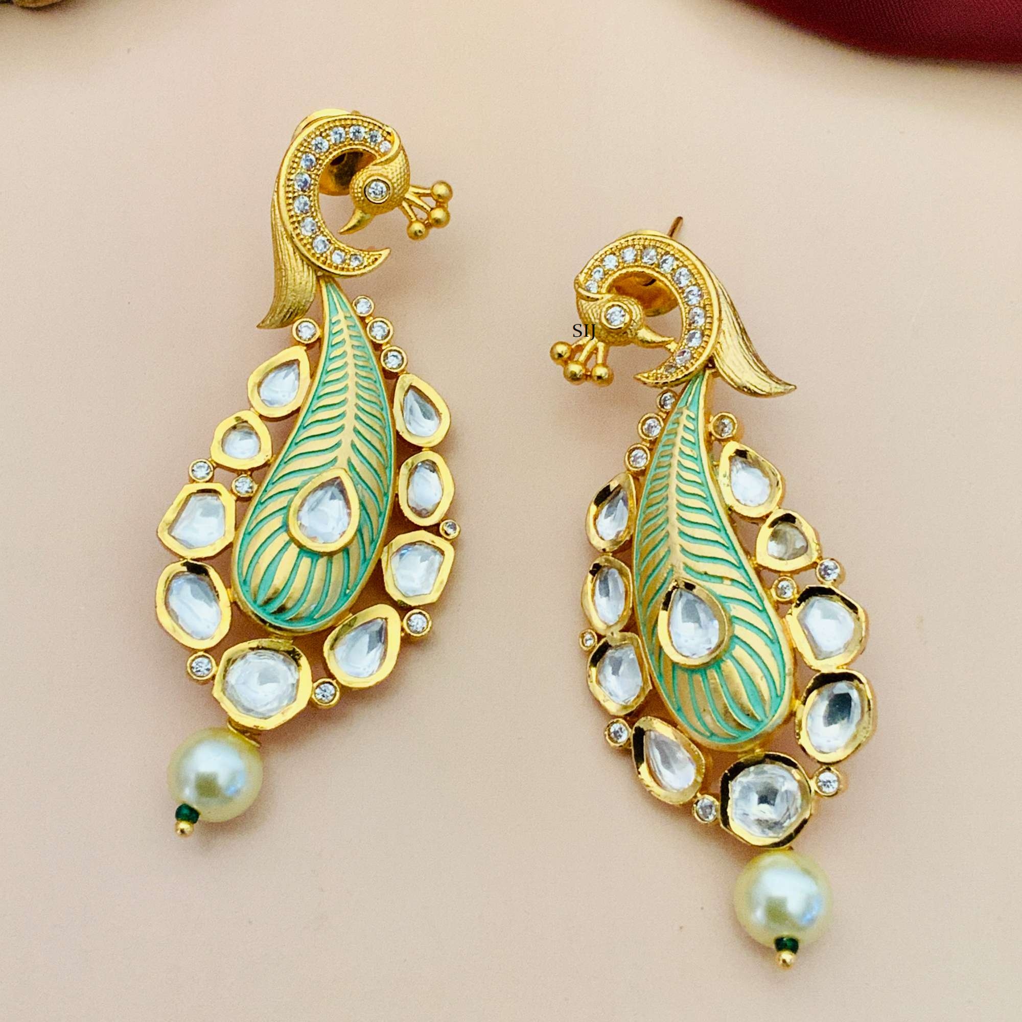 Matte Finish Kundan Peacock Design Earrings with White Stone