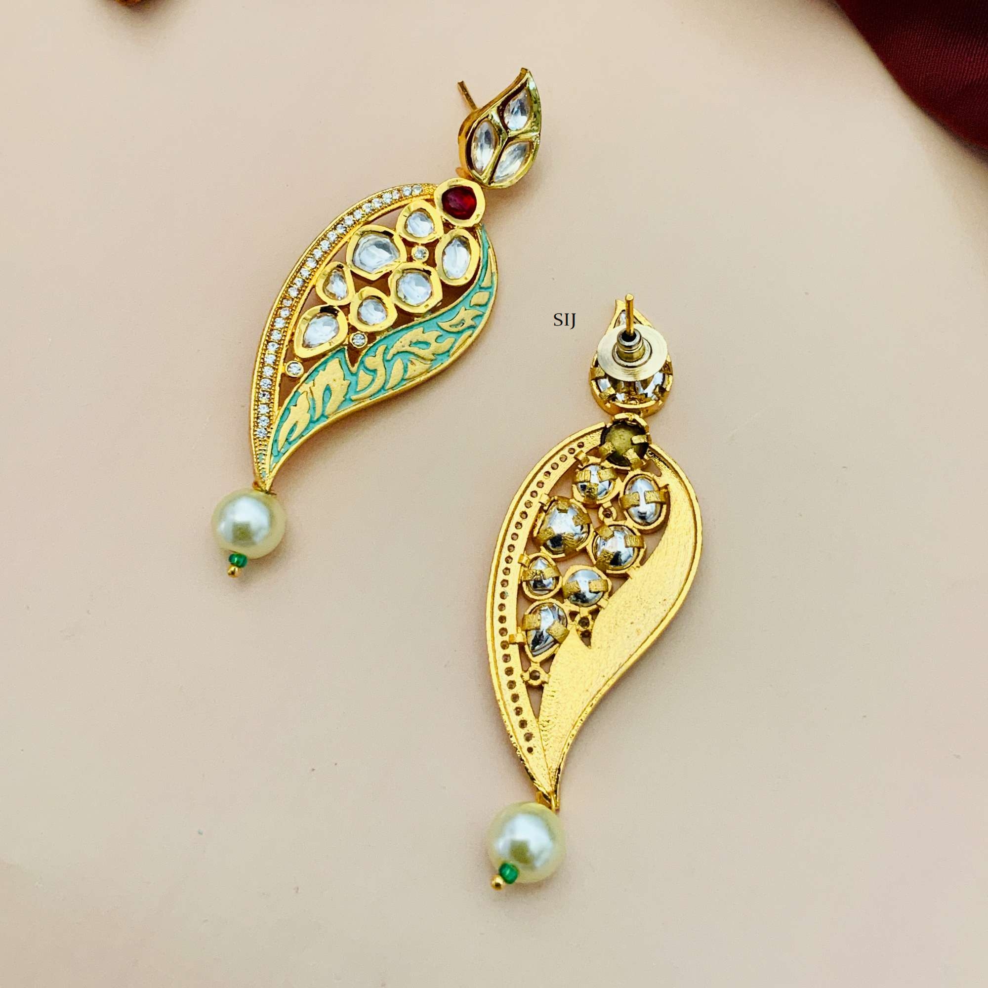 Matte Finish Leaf Design Kundan Earrings with Red Stone