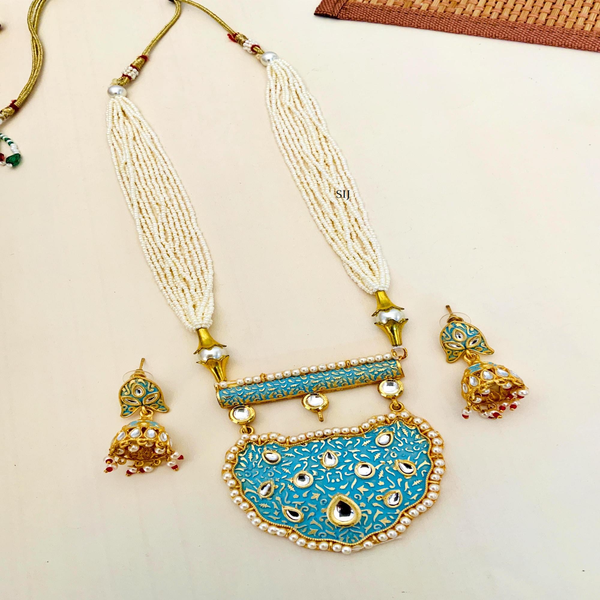Multi Layers Pearl Beaded Haram with Kundan Studded Blue Pendant
