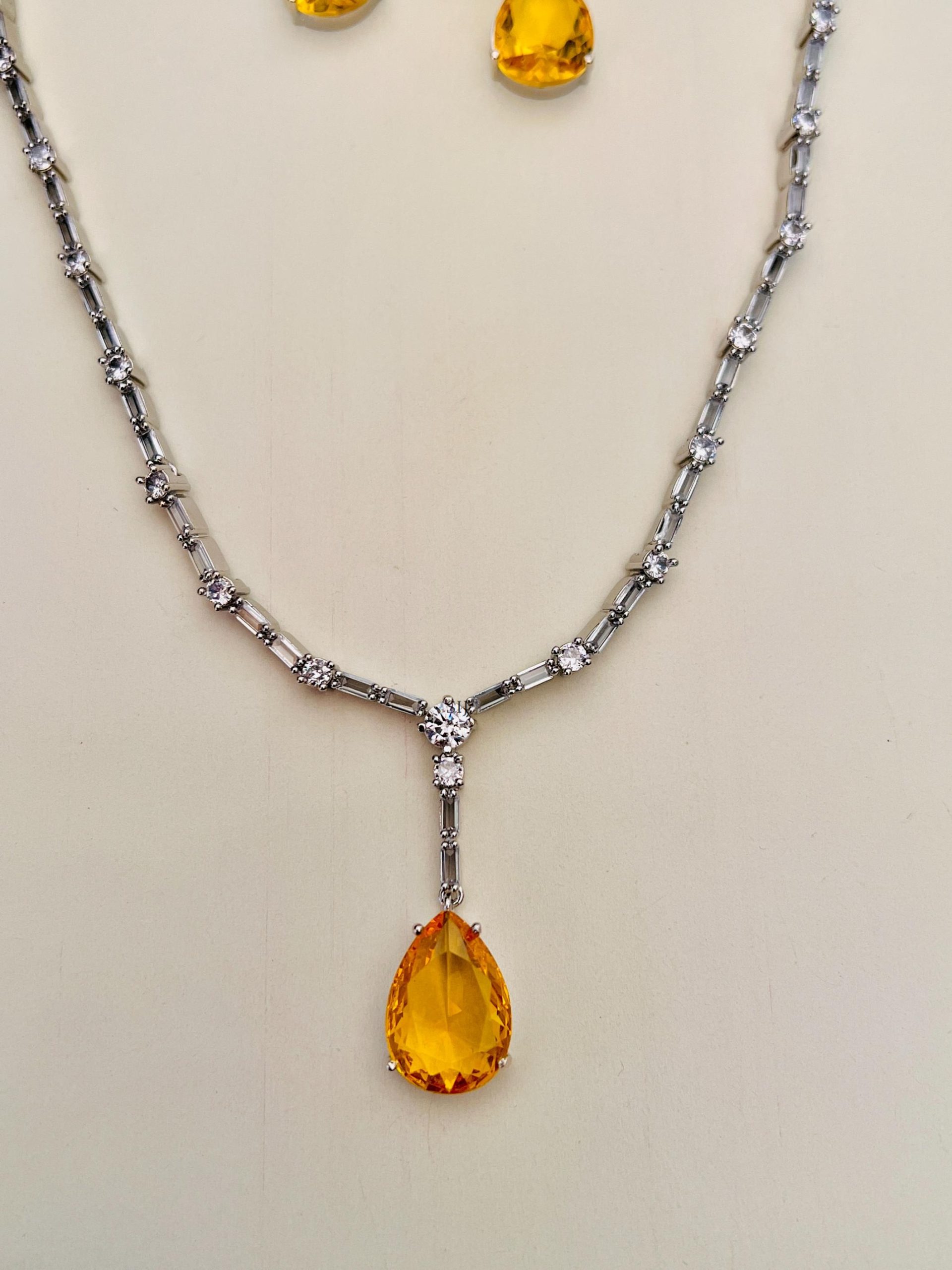 Yellow Stone Tear Drop Pendant with Silver Plated AD Stones Chain
