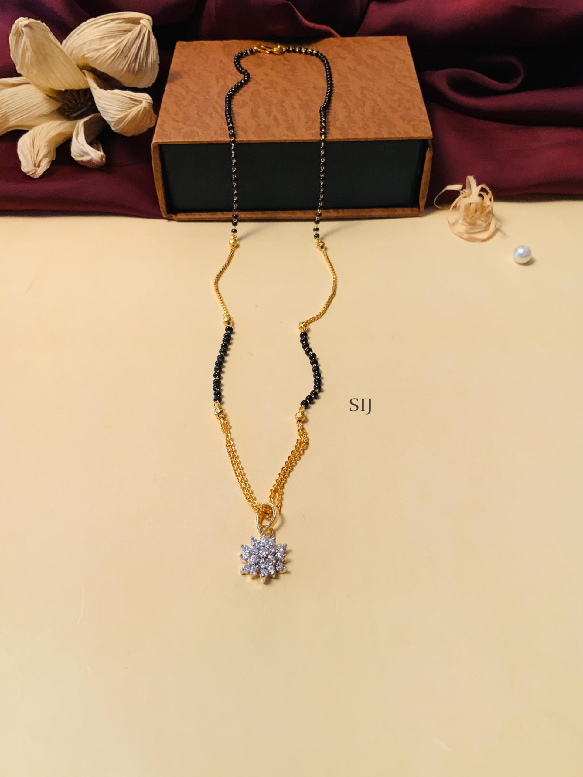 Imitation Black Beaded And Gold Plated Solitaire Diamond Mangalsutra