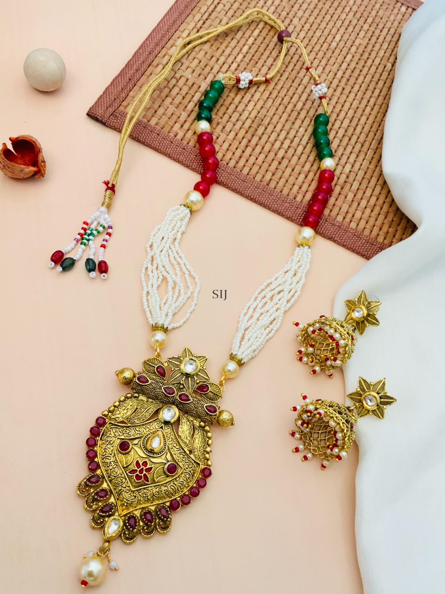 Gold Finish Red Kundan Pearl Necklace With Star Jhumkas