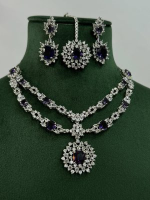 Silver Plated Flower Design Blue Stone AD Necklace With Earrings And Maang Tikka