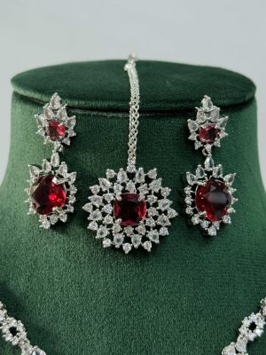 Silver Plated Flower Design Red Stone AD Necklace With Earrings And Maang Tikka