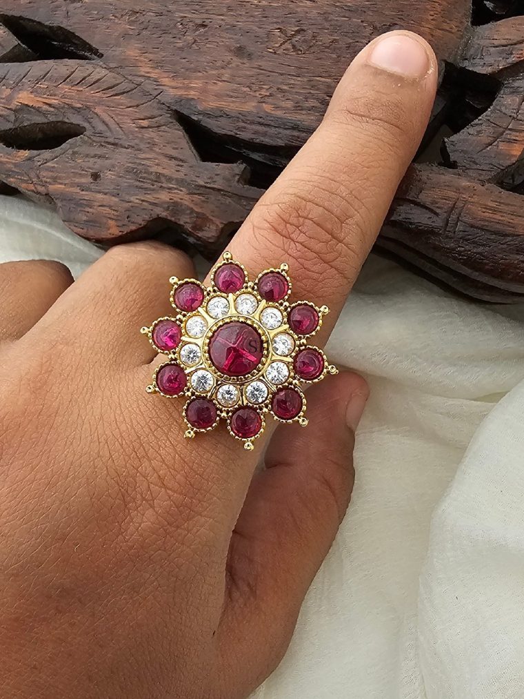 Enhance your elegance with the White & Red Kemp Stones Flower Design Finger Ring.