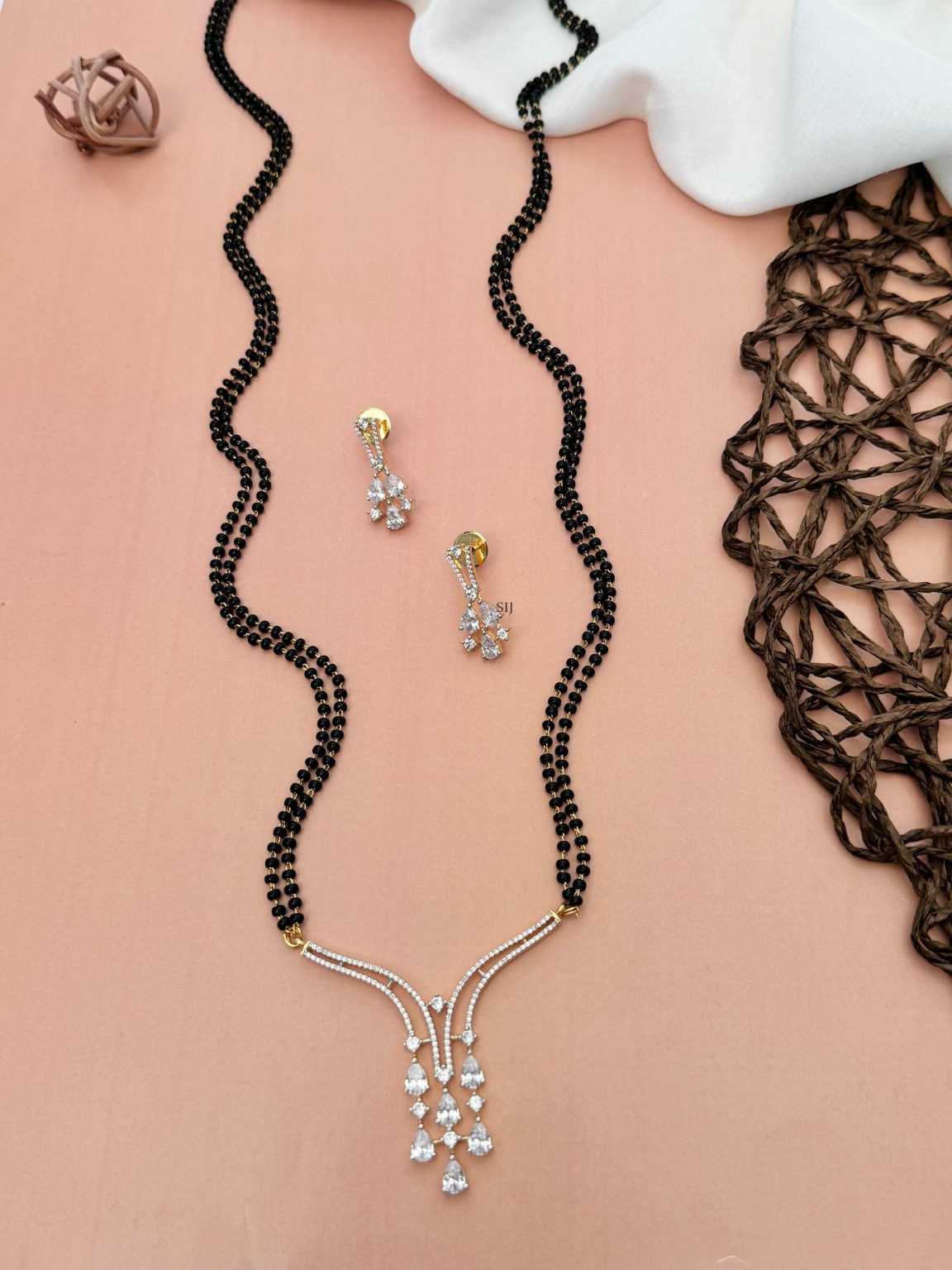 Two Layers Black Beads Mangalsutra with AD Stones Tear Drop Design Pendant