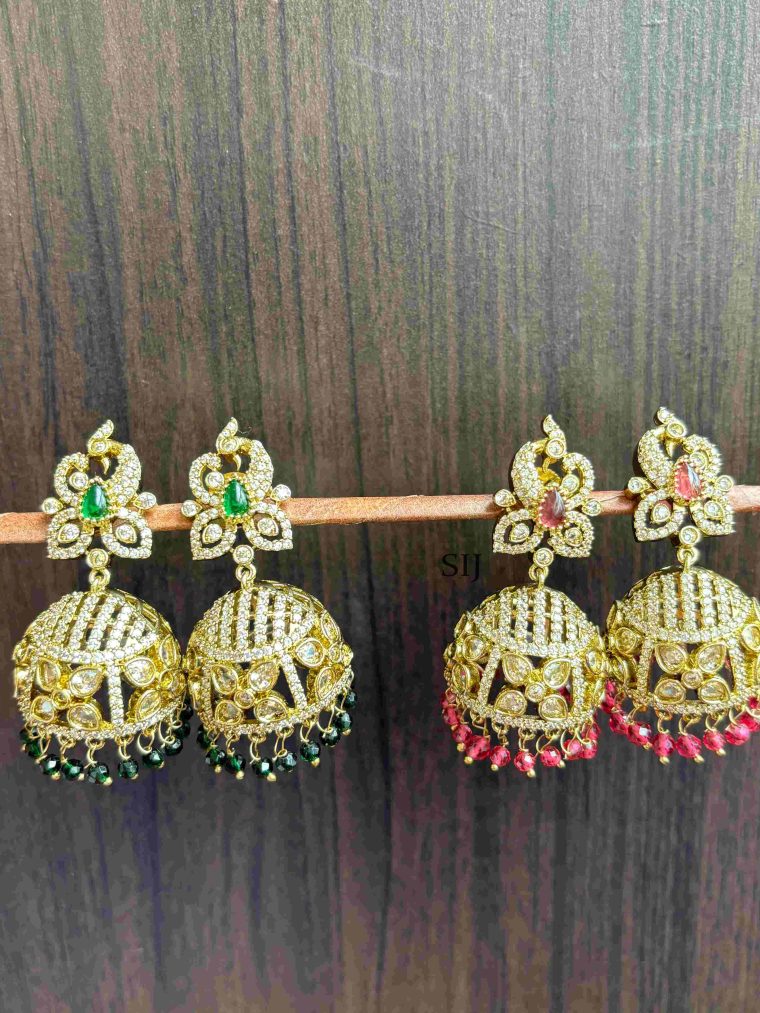 ImitatioEnhance your look with the Imitation Victorian Stones Jhumkas, a beautiful fusion of vintage elegance and contemporary design. These intricately crafted jhumkas feature stunning Victorian-inspired detailing, adorned with sparkling imitation stones that add a touch of sophistication. Ideal for weddings, festive events, or cultural celebrations, they effortlessly complement traditional attire while adding a regal charm to your ensemble. Designed for comfort and style, these lightweight earrings ensure all-day wear without compromising on beauty. Perfect for those who appreciate timeless jewelry, these Victorian-style jhumkas are a must-have addition to your collection for a graceful and elegant statement.n Victorian Stones Jhumkas