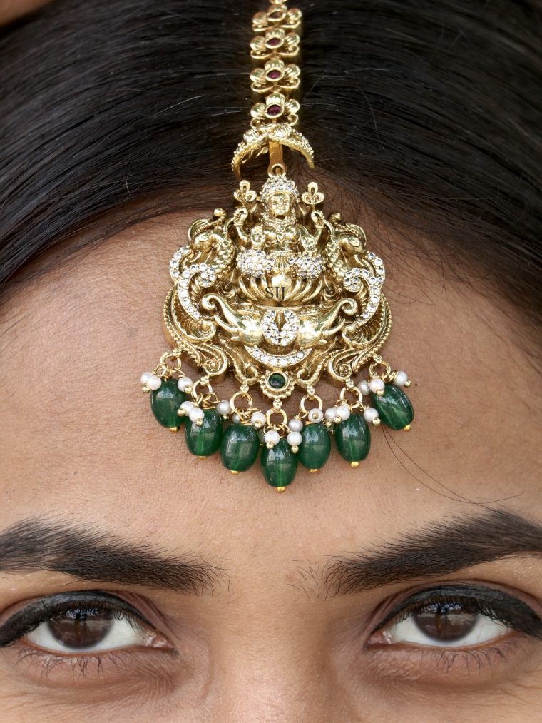 Gold Finish Lakshmi Devi Tikka with Green Beads Hangings