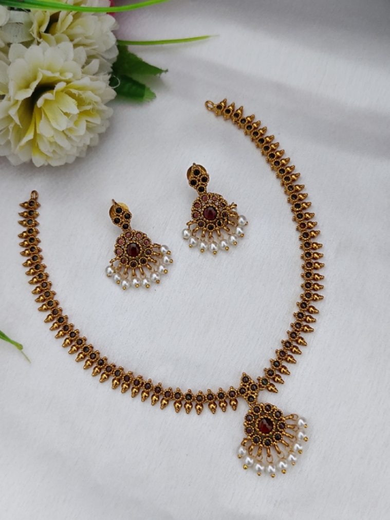 Gold Finish Red Stones Attigai Necklace