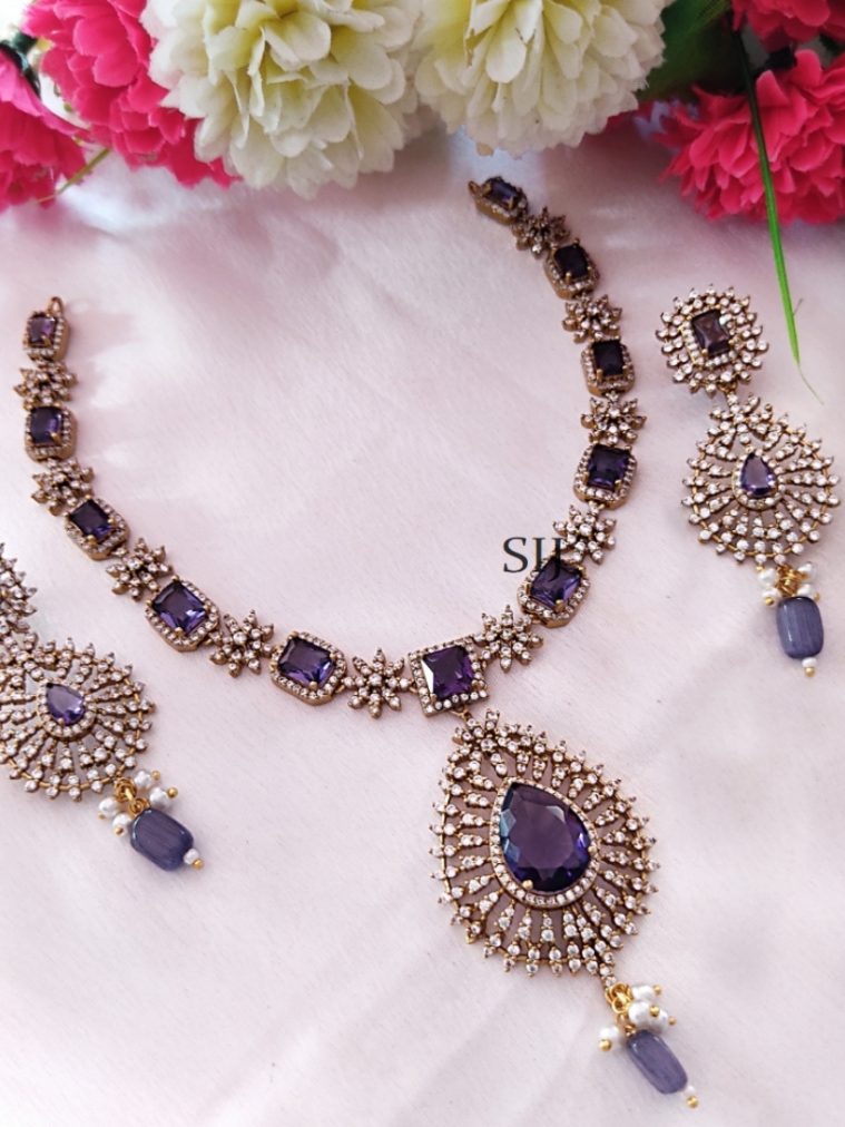 Gold Finish White And Grey Stones Necklace